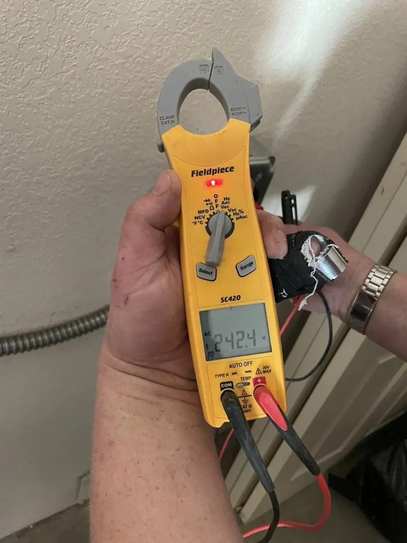 Voltage testing with clamp meter during Recessed Lighting Installation in Ingram